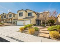 Charming two-story home with a well-maintained front yard and a two-car garage, perfect for Gathering living at 97 Parker Ranch Dr, Henderson, NV 89012