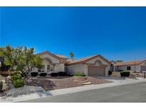 Charming single-story home with well-maintained landscaping and a two-car garage at 10025 Netherton Dr, Las Vegas, NV 89134