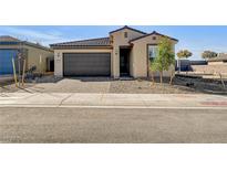 Charming single-story home featuring a two-car garage, desert landscaping, and a welcoming front entrance at 10255 Crimson Currant St, Las Vegas, NV 89143