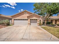 Charming single-story home featuring a two-car garage and well-maintained landscaping at 1562 Pimlico Hills St, Henderson, NV 89014