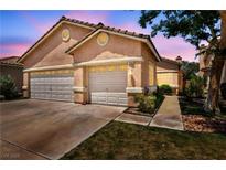Charming home with a three-car garage and well-maintained landscaping at 1562 Pimlico Hills St, Henderson, NV 89014