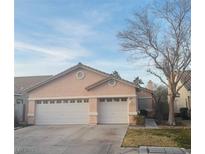 Charming single-story home with a well-maintained front yard and a two-car garage at 1562 Pimlico Hills St, Henderson, NV 89014