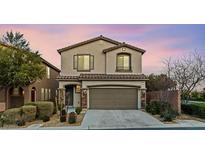 Charming two-story home featuring a neutral color palette and well-manicured front yard at 902 Earth Luster Rd, Las Vegas, NV 89178