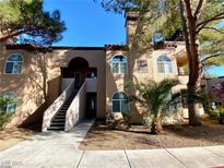 Two story condo building with desert landscaping and walkways leading to units at 9325 W Desert Inn Rd # 250, Las Vegas, NV 89117