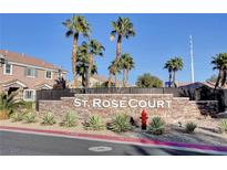 St. Rose Court community entrance sign with desert landscaping, palm trees, and blue skies at 10074 Aspen Rose St # 101, Las Vegas, NV 89183
