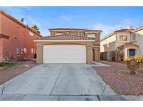 Charming two-story home with a well-maintained front yard and attached two-car garage at 10273 Grecian Laurel Ct, Las Vegas, NV 89183