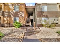 Condo exterior featuring a landscaped yard and a walkway to the units at 2200 S Fort Apache Rd # 1007, Las Vegas, NV 89117
