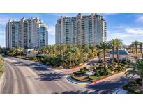 Stunning high-rise condos feature lush landscaping, palm trees, and gated entry at 9103 Alta Dr # 102, Las Vegas, NV 89145