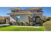Stunning two-story home with desert landscaping and a stone accent facade at 21 Levan Hills Trl, Henderson, NV 89052