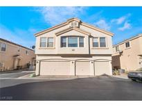 Charming two-story home featuring a three-car garage and neutral stucco exterior at 5961 High Steed St # 103, Henderson, NV 89011