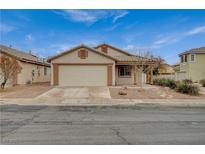 Charming single story home featuring a two-car garage and covered porch at 612 Bullwhip Ct, Henderson, NV 89011