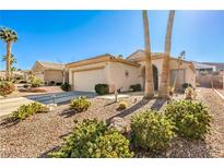 Charming single-story home features desert landscaping, a two-car garage, and a welcoming front entrance at 1805 Joy Grove Ave, Henderson, NV 89012