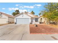 Charming single-story home with a well-maintained yard, driveway, and attached garage at 1999 Dry Falls St, Las Vegas, NV 89142