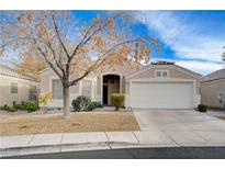 Charming single-story home featuring a two-car garage, complemented by a well-maintained, low-water landscape at 2517 New Salem Ave, Henderson, NV 89052