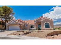 Charming single-story home with well-manicured desert landscaping and a two-car garage at 2937 Billy Casper Dr, Las Vegas, NV 89134