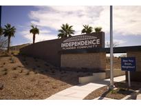 Independence Planned Community entrance featuring desert landscaping and a welcoming sign at 2946 Plum Torte St, Las Vegas, NV 89122