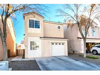 Charming two-story townhome with attached single car garage and concrete driveway at 5476 Green Horn St, Las Vegas, NV 89118