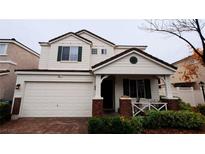 Charming two-story home with a two-car garage, manicured landscaping, and inviting front porch at 6239 Carson Hills Ave, Las Vegas, NV 89139