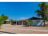 Charming single-story home featuring low maintenance desert landscaping and white exterior at 724 6Th St, Boulder City, NV 89005