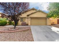 Inviting single-story home featuring a well-maintained front yard and a two-car garage at 8233 Valley Stream Ave, Las Vegas, NV 89131