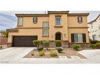 Charming two-story home featuring manicured landscaping, a two car garage, and inviting front entrance at 8376 Rygate Ave, Las Vegas, NV 89178