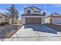 Charming two-story home featuring a well-maintained yard and attached two-car garage at 8645 Panuco Way, Las Vegas, NV 89147