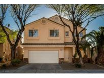Charming two-story home with a well-manicured front yard and a two car garage at 1219 Diamond Valley St, Henderson, NV 89052
