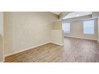 Bright living room featuring wood flooring, neutral paint, and lots of natural light at 20 Serene Ave # 201, Las Vegas, NV 89123