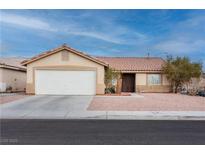 Charming single-story home featuring a two-car garage and desert landscaping for low maintenance at 5314 Sable Ct, North Las Vegas, NV 89031