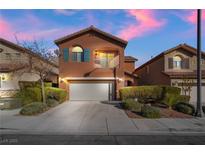 Charming two-story home with a balcony, a two-car garage, and well-maintained landscaping at 10858 La Florentina Ave, Las Vegas, NV 89166