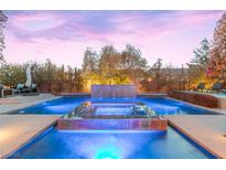 Stunning pool features a raised spa and beautiful water features, perfect for relaxation and entertainment at 12169 Castilla Rain Ave, Las Vegas, NV 89138