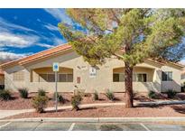 Charming single-story building with desert landscaping and parking in front at 1881 W Alexander Rd # 1025, North Las Vegas, NV 89032