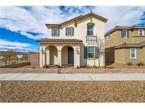 Charming two-story home featuring an arched entry and well-maintained landscaping at 3543 Brittoli Ave, Henderson, NV 89044