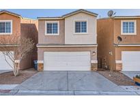 Two-story home features a two car garage and a well maintained front yard at 4052 Rocky Beach Dr, Las Vegas, NV 89115