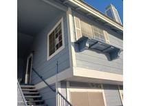 Blue two-story apartment building featuring steps leading up to the front door and charming window boxes at , Las Vegas, NV 89122