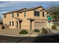 Charming two-story home features a manicured lawn and attached two-car garage at 108 Fiery Hill Ave, Henderson, NV 89011