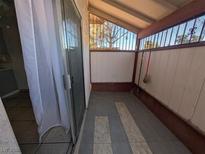 Enclosed patio with tile flooring, and screened windows providing natural light at 441 N Lamb Blvd # E, Las Vegas, NV 89110