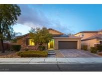 Charming single-story home with a well-manicured front yard and a two-car garage at 5646 Sophie Belle Ave, Las Vegas, NV 89131
