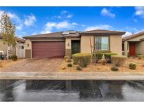 Charming single-story home featuring a brick driveway and a two-car garage at 5716 Alitak Bay St, North Las Vegas, NV 89081