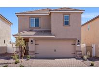 Two-story home with a stucco exterior, tile roof, and a two-car garage, complemented by a well-maintained front yard at 6252 Blood Lily Ave, Las Vegas, NV 89122
