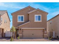 Charming two-story home showcasing a well-maintained front yard and an attached two-car garage at 6264 Blood Lily Ave, Las Vegas, NV 89122