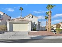 Charming single-story home with desert landscaping, two-car garage, and a welcoming facade under a sunny sky at 6652 Goldencreek Way, Las Vegas, NV 89108