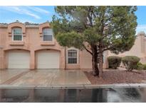 Charming townhome featuring an attached garage and well-maintained landscaping at 8440 Wandering Sun Ave, Las Vegas, NV 89129