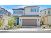 Charming two-story home featuring a brick driveway and well-maintained landscaping at 2713 Royal Tourist Rd, North Las Vegas, NV 89086