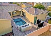 A beautiful backyard pool and patio area offer a private space for relaxation and outdoor enjoyment at 7331 Abundant Harvest Ave, Las Vegas, NV 89131