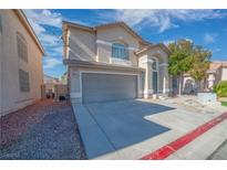 Two-story home featuring a two-car garage, neutral stucco exterior, and manicured front yard at 8109 Terracotta Gulf Ct, Las Vegas, NV 89143