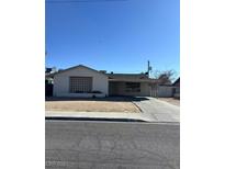 Modest single-story home with a simple concrete block pattern at the facade on a clear day at 4101 Esmeralda Ave, Las Vegas, NV 89102