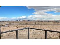 Balcony view showcasing the city skyline, desert landscape, and beautiful cloud formations in the sky at 8255 Las Vegas Blvd # 711, Las Vegas, NV 89123
