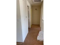 Neutral hallway featuring tile flooring and white paint at 2060 Rancho Lake Dr # 202, Las Vegas, NV 89108