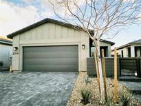 Charming single-story home featuring a two-car garage and desert landscaping at 2379 Albury Ave, North Las Vegas, NV 89086